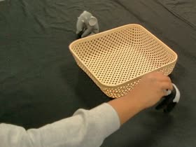 Human grasping the panda toy